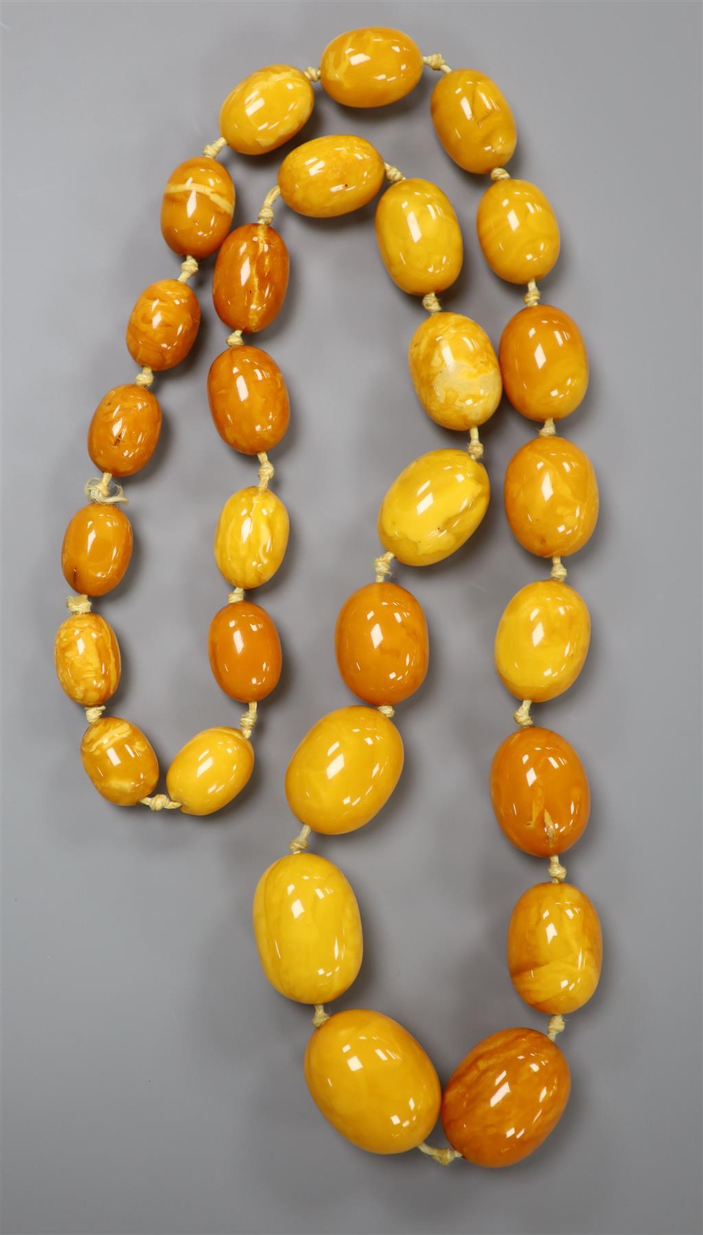 A single strand graduated amber bead necklace, 73cm, gross 101 grams.